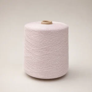 Cone sợi cotton mercerized JC60S/2 màu hồng phấn nhạt trên nền sáng