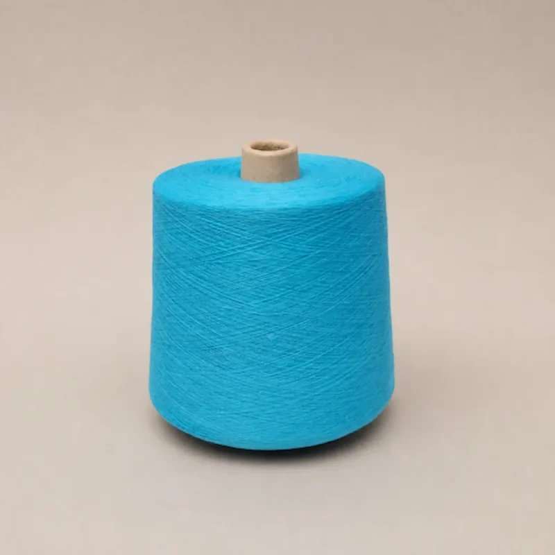 Cone sợi cotton màu xanh ngọc Cone sợi cotton chải kỹ nhuộm màu xanh ngọc JC32S/1 trên nền sáng