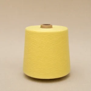 Cone sợi cotton chải kỹ màu vàng dùng cho máy dệt tất