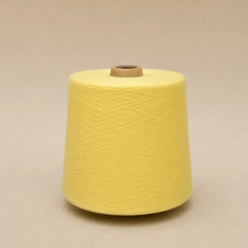 Cone sợi cotton chải kỹ màu vàng dùng cho máy dệt tất