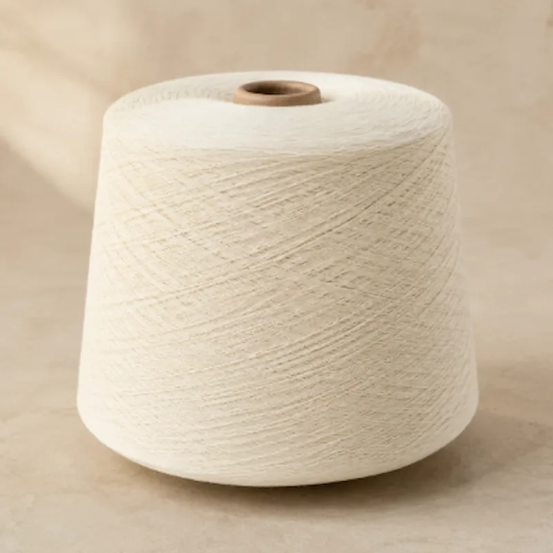 Cone sợi cotton nhuộm màu trắng ngà quấn trên lõi giấy