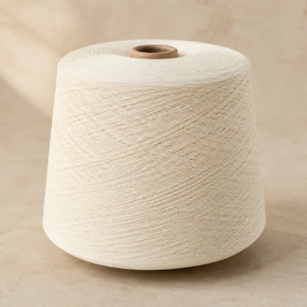 Cone sợi cotton nhuộm màu trắng ngà quấn trên lõi giấy