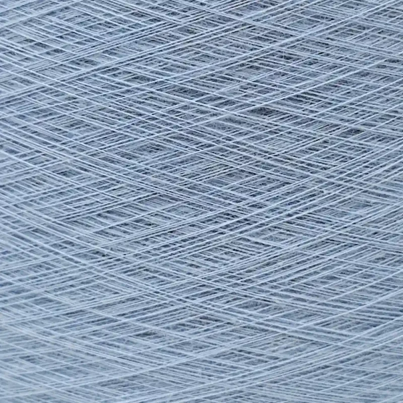 Cận cảnh sợi cotton Ne 30s2 nhuộm màu xanh Cận cảnh sợi cotton 100% Ne 30s/2 nhuộm màu xanh với các lớp sợi đan chéo