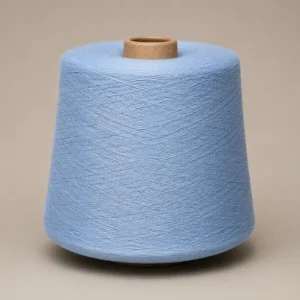 Cone sợi màu xanh nhạt quấn đều trên ống giấy